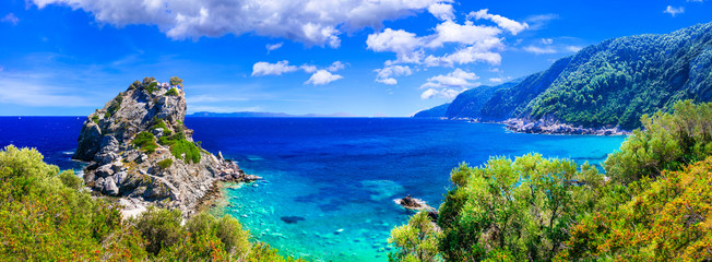 Beautiful Greek islands- Skopelos. view of rock and church Agios Ioanis. northen Sporades - obrazy, fototapety, plakaty