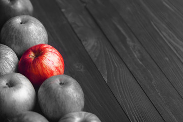 The right choice, the right thing. Black and white photo with a red apple.