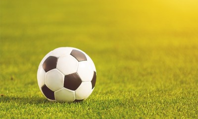 Football on green field