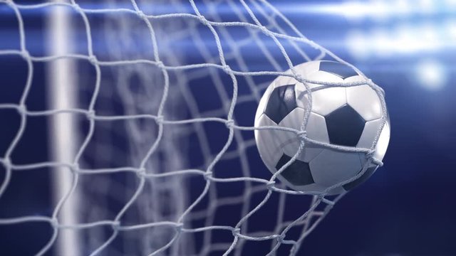 Beautiful soccer ball flies into net. Projector of light on a background. In slow motion
