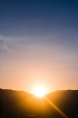 Amazing sunset with mountain silhouette