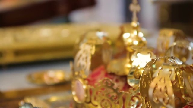 Wedding rings of newlyweds during the consecration of holy water in the church