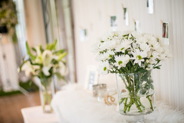 Beautiful bouguet of white chamomiles flowers in water can, watering pot, concept vintage style