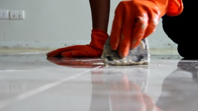 Grouting ceramic tiles