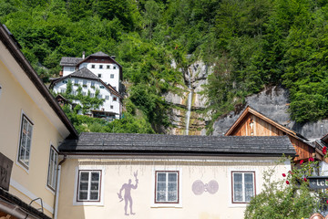 Houses with Waterfall in Hallstatt, Austria