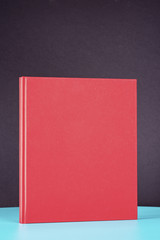 Fototapeta premium Red book on the green metal table.