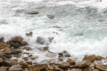 waves crashing against rocks