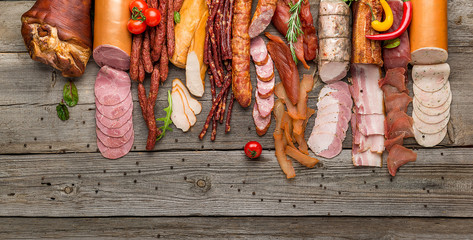 Assortment of cold meats, variety of processed cold meat products - obrazy, fototapety, plakaty