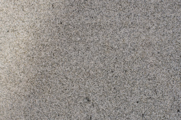 The beige colored wall with the cracked stucco texture background.