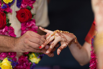 elements of Vedic wedding wearing rings close up