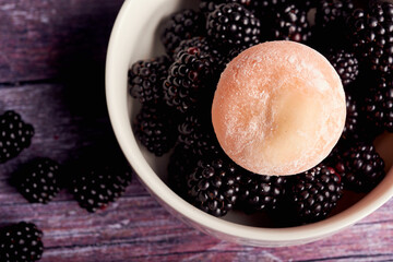 The colorful mochi dessert ice cream with blackberry
