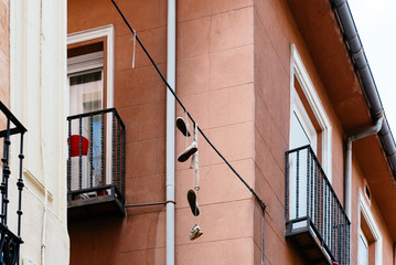 Shoes hanging on wire in Lavapies in Madrid