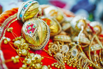 Selective focus of coconut decoration in gold for indian wedding