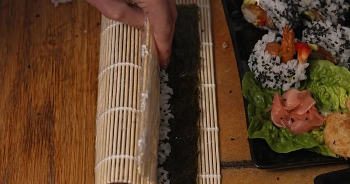 Wrapping, rolling sushi