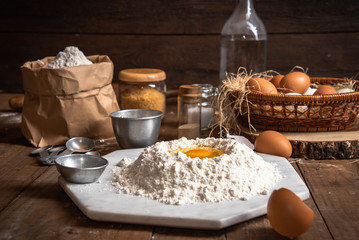 The ingredients for cakes and preparing material for making bread.In the atmosphere of farm and rural style.