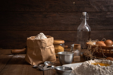 The ingredients for cakes and preparing material for making bread.In the atmosphere of farm and rural style.