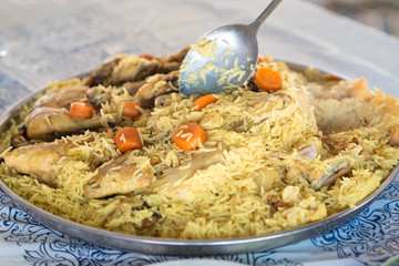 Maqluba traditional Arab food.The dish includes meat, rice, and