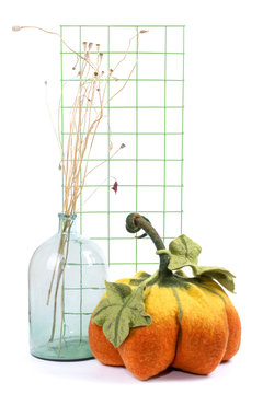 Still life with handmade pumpkins from felted wool for the celebration of Halloween