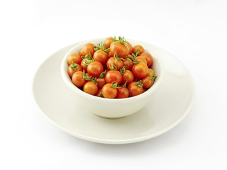 Fresh cherry tomatoes in bowl isolated on white background