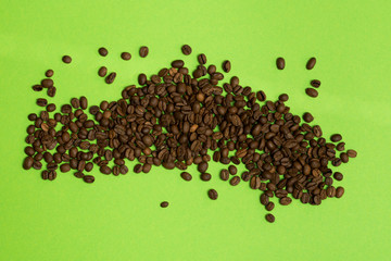 coffee beans on green background
