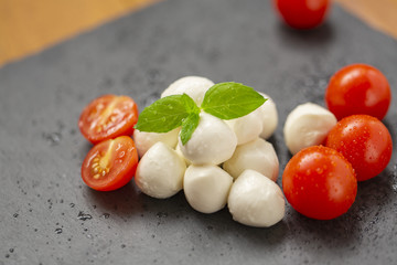 Mozzarella with tomatoes and arugula