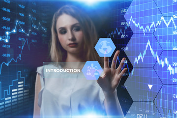 The concept of business, technology, the Internet and the network. A young entrepreneur working on a virtual screen of the future and sees the inscription: introduction
