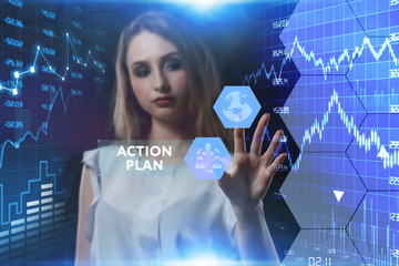 The concept of business, technology, the Internet and the network. A young entrepreneur working on a virtual screen of the future and sees the inscription: action plan