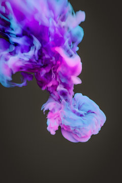 a colorful blue pink ink splash in water