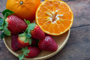 Fototapeta na wymiar strawberry and orange fruit vitamin diet for healthy