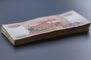 A lot of Russian money. Face value of five thousand rubles.