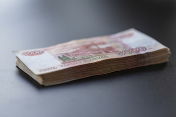 A lot of Russian money. Face value of five thousand rubles.