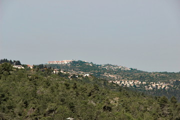 photo of green Mountains with settlements near Jerusalem, Israel