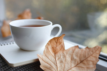 Hot drink and notepad