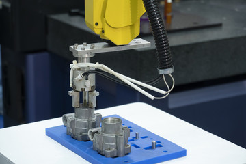 The robotic arm catch the aluminum part for manufacturing   process .The hi-technology for modern manufacturing process.
