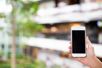 A female hand holding mobile phone.
