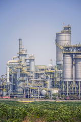 Chemical refinery plant with blue sky , soft tone color