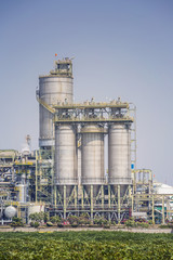 Fototapeta na wymiar Chemical refinery plant with blue sky , soft tone color