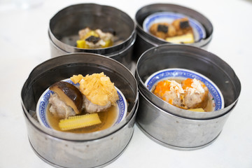 Dim sum on a food shelves, various Chinese steamed dumpling in bamboo basket steamer in Chinese restaurants.Yumcha or Dimsum