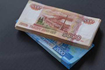 Russian money, packs of Russian banknotes of five thousand and two thousand rubles. Place for text