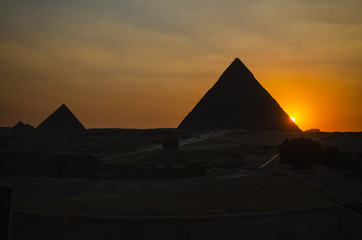 Fototapeta na wymiar Sunset on the Pyramids of Giza, Cairo, Egypt