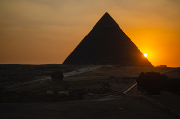 Obraz na płótnie Canvas Sunset on the Pyramids of Giza, Cairo, Egypt