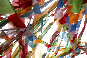 Buddhist prayer flags blowing in wind, Qinghai, China