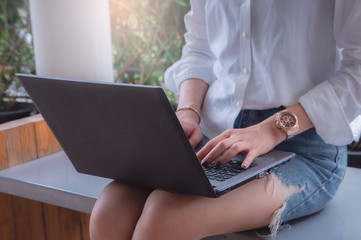 Fototapeta premium using notebook everywhere, working online on laptop