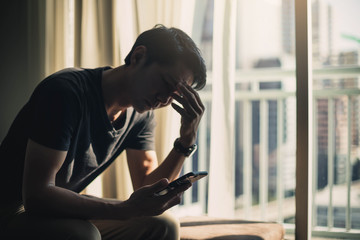 Sad man lying on the floor full of desperation thoughts .Portrait of thoughtful sad man alone....