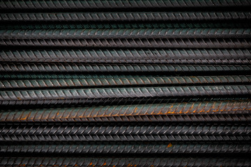 Black metal rods for reinforcement concrete building construction close up.