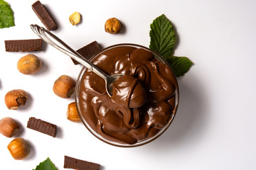 Hazelnut spread with mint leaves in a jar