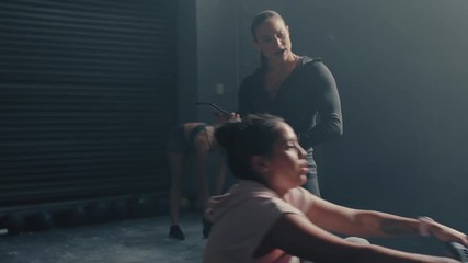 fitness athletes training using rowing machine diverse friends enjoying intense exercise together tough workout challenge in gym 