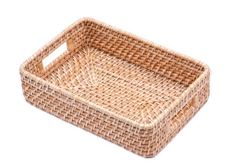 Handwoven in Indonesia exotic and functional rattan storage basket isolated on white background.