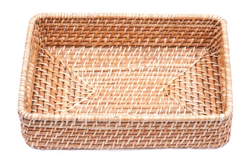 Handwoven in Indonesia exotic and functional rattan storage basket isolated on white background.