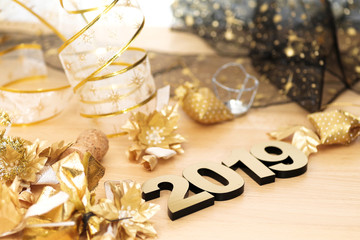 Fototapeta na wymiar Happy New Year 2019. Symbol from number 2019 on wooden background